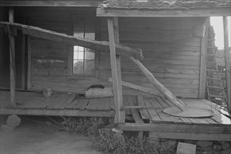 Porch of a sharecropper's cabin, Hale County, Alabama.
