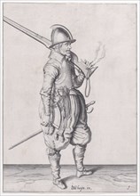 A soldier holding his caliver, from the Marksmen series, plate 1, in Waffenhandl..., published 1608. Creator: Robert Willemsz de Baudous.