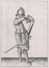 A soldier charging his caliver which is held stock down, from the Marksmen serie..., published 1608. Creator: Robert Willemsz de Baudous.