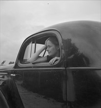 Untitled, 1935-1942. [Woman in a car]. Creator: Unknown.