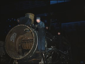 Working on the boiler of a locomotive at the 40th Street shops of the C & NW RR, Chicago, Ill., 1942 Creator: Jack Delano.