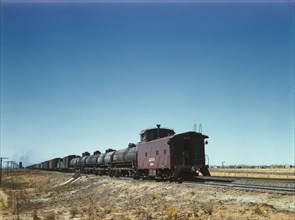 Santa Fe R.R. west bound freight stopping for water, Melrose, New Mexico, 1943. Creator: Jack Delano.