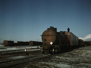 A train (or "cut") being pushed out of a receiving..., Proviso yard, C & NW RR., Chicago, Ill., 1942 Creator: Jack Delano.