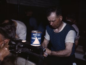 Joseph Klesken washing up after a day's work...Proviso yards of the C & NW RR, Chicago, Ill., 1943. Creator: Jack Delano.