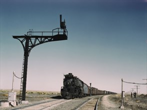 West bound Santa Fe R.R. freight train waiting in a siding..., Ricardo, New Mexico, 1943. Creator: Jack Delano.
