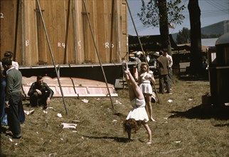 At the Vermont state fair, Rutland, "backstage" at the "girlie" show, 1941. Creator: Jack Delano.