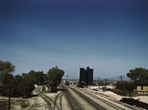 Santa Fe R.R. going through Yucca, Arizona; a watering and refueling stop, 1943. Creator: Jack Delano.