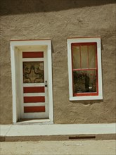 Door and window in a Spanish-American home, Costilla, New Mexico, 1940. Creator: Russell Lee.