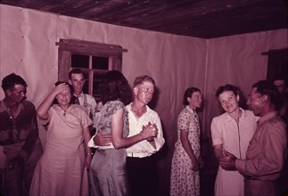 Scene at square dance in rural home in McIntosh County, Oklahoma, 1939 or 1940. Creator: Russell Lee.