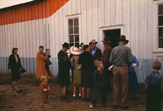 Group of homesteaders in front of the bean house ..., Pie Town, New Mexico Fair, 1940. Creator: Russell Lee.