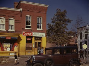 Car in front of Shulman's Market on N at Union St. S.W., Washington, D.C., between 1941 and 1942. Creator: Louise Rosskam.
