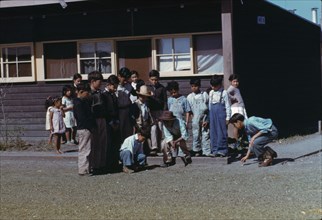 Boys playing marbles, FSA ... labor camp, Robstown, Texas, 1942. Creator: Arthur Rothstein.