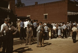 Farmers and townspeople in the center of town on Court Day, Campton, Ky., 1940. Creator: Marion Post Wolcott.