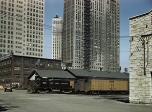 Diesel switch engine moving freight cars...South Water street...Illinois Central R.R., Chicago, 1943 Creator: Jack Delano.