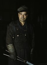 Daniel Anastazia, blacksmith's helper, Rock Island R.R., Blue Island, Ill., 1943. Creator: Jack Delano.
