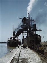 Loading a lake freighter with coal at the Pennsylvania R.R. coal docks...Sandusky, Ohio, 1943. Creator: Jack Delano.