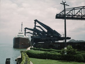 Pennsylvania R.R. [Railroad] ore docks, unloading iron ore from a lake..., Cleveland, Ohio, 1943. Creator: Jack Delano.