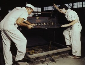 Learning to work a cutting machine, these two NYA employees...Corpus Christi, Texas, 1942. Creator: Howard Hollem.