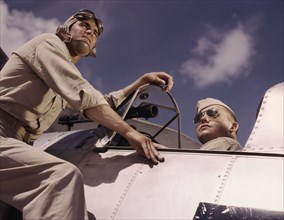 Ens[ign] Noressey and Cadet Thenics at the Naval Air Base, Corpus Christi, Texas, 1942. Creator: Howard Hollem.