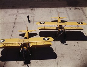 Navy N2S primary land planes at the naval Air Base, Corpus Christi, Texas, 1942. Creator: Howard Hollem.
