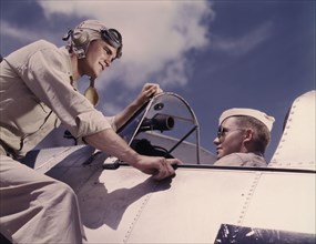 Ensign Noressey and Cadet Thenics at the Naval Air base, Corpus Christi, Texas, 1942. Creator: Howard Hollem.