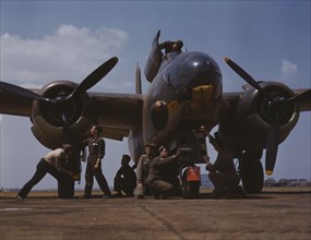Servicing an A-20 bomber, Langley Field, Va., 1942. Creator: Alfred T Palmer.