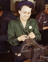 War production worker at the Vilter [Manufacturing] Company making M5...Milwaukee, Wis. , 1943. Creator: Howard Hollem.