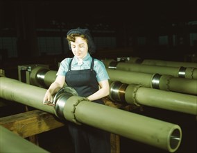 Gist inspector, Mrs. Mary Betchner inspecting one of the 25 cutters..., Milwaukee, Wis. , 1943. Creator: Howard Hollem.