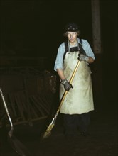 C. & N.W. R.R., Mrs. Elibia Siematter, working as a sweeper at the roundhouse, Clinton, Iowa, 1943. Creator: Jack Delano.