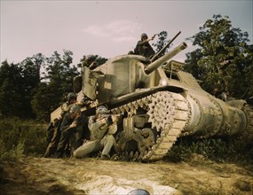 M-3 tank and crew using small arms, Ft. Knox, Ky., 1942. Creator: Alfred T Palmer.