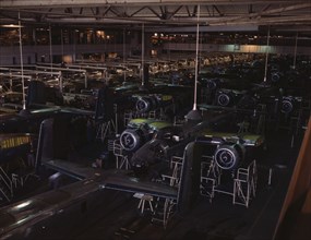 View of the B-25 final assembly line at North American Aviation's Inglewood, California, plant, 1942 Creator: Alfred T Palmer.