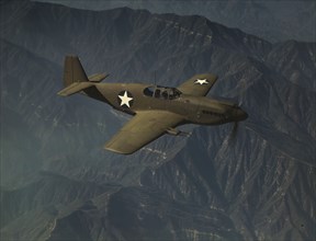 P-51 "Mustang" fighter in flight, Inglewood, Calif. , 1942. Creator: Alfred T Palmer.