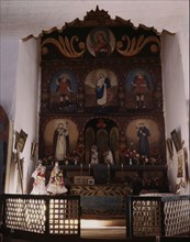 The main altar in the church, Trampas, N.M. , 1943. Creator: John Collier.