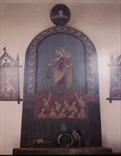 The altar of Nuestra Senora del Carmel on the south wall of the church, Trampas, N.M., 1943. Creator: John Collier.
