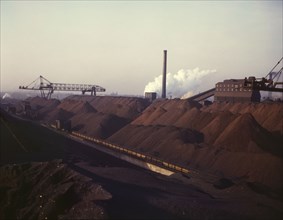 Hanna furnaces of the Great Lakes Steel Coporation, stock pile of coal and..., Detroit, Mich., 1942. Creator: Arthur S Siegel.