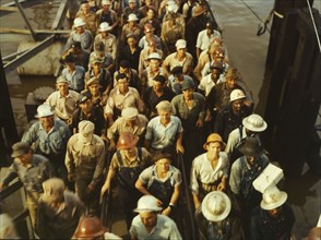 Workers leaving Pennsylvania shipyards, Beaumont, Texas, 1943. Creator: John Vachon.