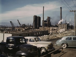 Steel and concrete go into place rapidly as a new steel...Columbia Steel Co., Geneva, Utah, 1942. Creator: Andreas Feininger.