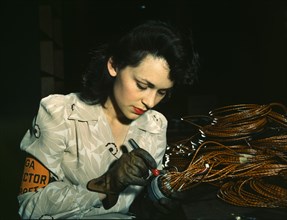Woman aircraft worker, Vega Aircraft Corporation, Burbank, Calif. , 1942. Creator: David Bransby.