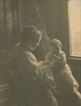 Mother and child, c1900.