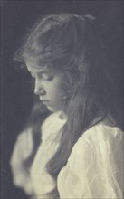 Young girl in profile , c1900.