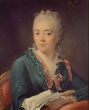 Portrait of a woman holding a book.