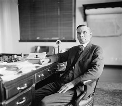 S.G. Hopkins, between 1910 and 1920. Man at writing desk.
