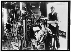 G.N. Press Car, between 1913 and 1918. Men in printing works.