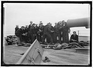 Cleaning 12' gun, between 1910 and 1920. US Navy personnel.