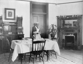 Serving the dinner, 1899 or 1900. Creator: Frances Benjamin Johnston.