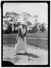 Mrs. Ed .. playing golf, between 1913 and 1917.