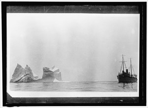 Ship at sea near iceberg, between 1910 and 1917.