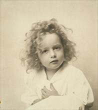 Portrait of a young girl with tousled hair, c1900.