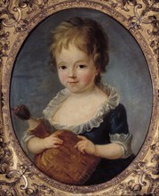 Portrait d'une petite fille tenant une poupée.