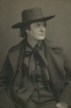Elbert Hubbard, half-length portrait, facing right, c1900.